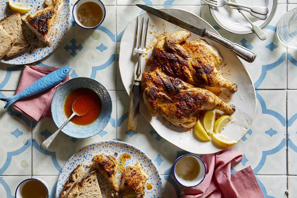 BRUSH WITH GREATNESS Basting with piri-piri hot sauce, whiskey, brandy and butter gives this chicken crisp skin and robust flavor.